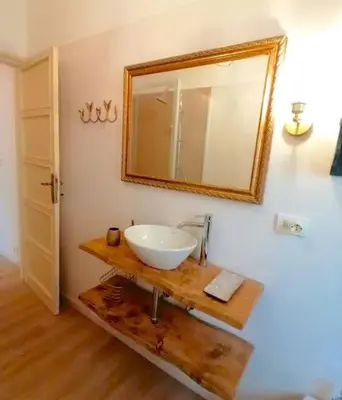 a bathroom with a sink and a mirror on the wall at Art House in Rome