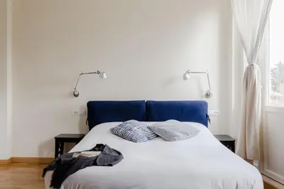 a bed with two pillows on it in a bedroom at Residenza del Cedro in Rome