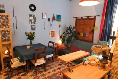 a living room with a table and a dining room at Lovely Sanctuary Central in Rome