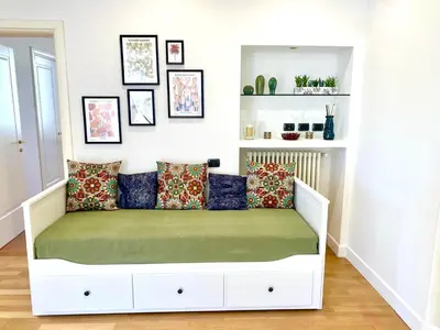 a white bed with pillows on it in a room at A&G central stay in Rome