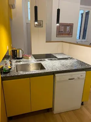 a kitchen with a sink and a counter top at Casa di Nonna, Piazza Navona in Rome
