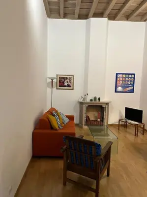 a living room with a couch and a table at Casa di Nonna, Piazza Navona in Rome