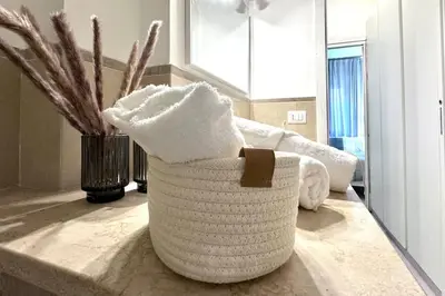 a white basket sitting on a counter in a kitchen at Appartamento Metro A e Vaticano Maroma in Rome