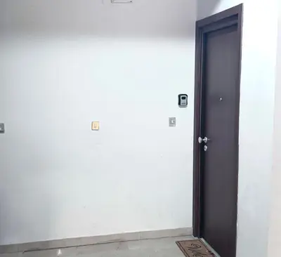 a black door in a room with a white wall at Appartamento Metro A e Vaticano Maroma in Rome