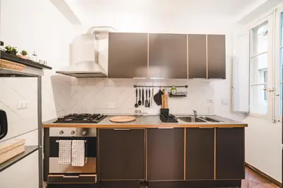 a kitchen with a sink and a stove at Cosy Colosseum in Rome