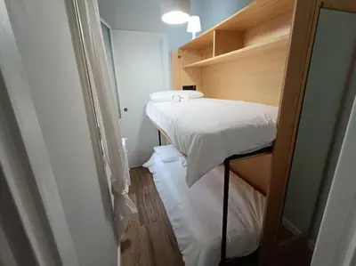 a small room with a bed and a closet at S Peter suite appartamento ristrutturato in centro in Rome