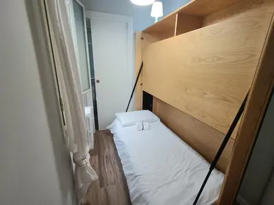 a small room with a bed in a room at S Peter suite appartamento ristrutturato in centro in Rome