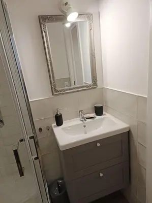 a bathroom with a sink and a mirror at S Peter suite appartamento ristrutturato in centro in Rome