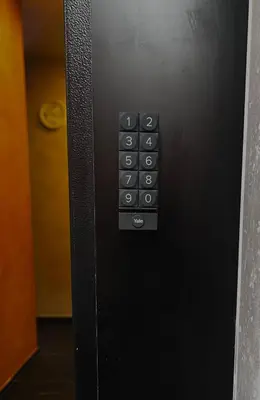 a close up of a remote control on a wall at Gold House Roma in Rome