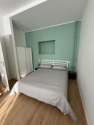 a bedroom with a large bed in a room at Maison Alteri in Rome