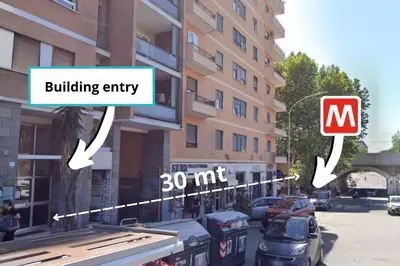 a city street with cars parked in front of a building at San Paolo Suites Metro Station in Rome