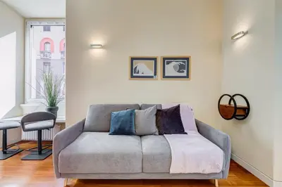 a living room with a couch and a chair at BDC - Purple Apt at San Giovanni in Rome