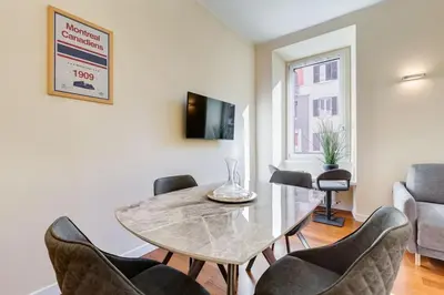 a dining room with a table and chairs at BDC - Purple Apt at San Giovanni in Rome