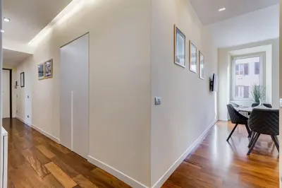 a hallway with a large glass wall in a house at BDC - Purple Apt at San Giovanni in Rome
