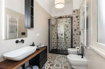 a bathroom with two sinks and a shower at Conca d'oro house in Rome