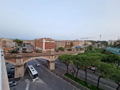 a bridge over a road in a city at VATICAN GUEST HOUSE ROOMS in Rome in Rome