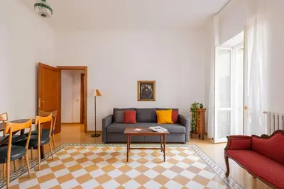 a living room with a couch and a table at Colosseum Number sixteen apartment in Rome