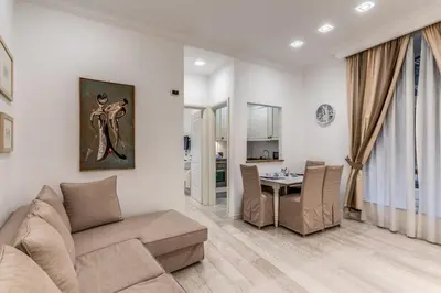 a living room with a couch and a table at Ciancaleoni Gruppo M&L Apartments in Rome