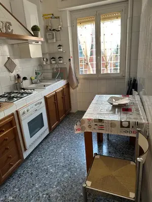 a kitchen with a sink and a stove top oven at Silvia's Home in Rome