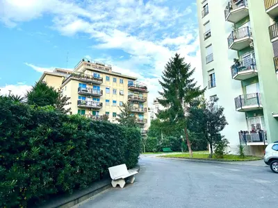 a white bench sitting in the middle of a street at Romantic Malatesta in Rome