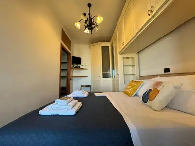 a bedroom with two beds with towels on them at Nice View in Ostiense with balcony in Rome
