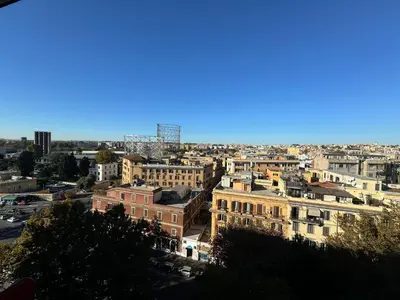 a view of a city with buildings at Nice View in Ostiense with balcony in Rome