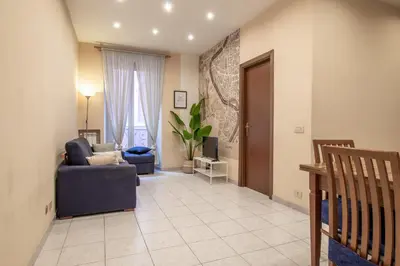 a living room with a couch and a chair at Borgo Vittorio 76 in Rome