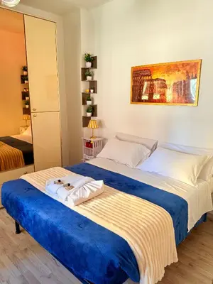 a white bathroom with a shower and a toilet and a sink at Gecko, cozy flat at 5min from Metro and 10min from Colosseum in Rome