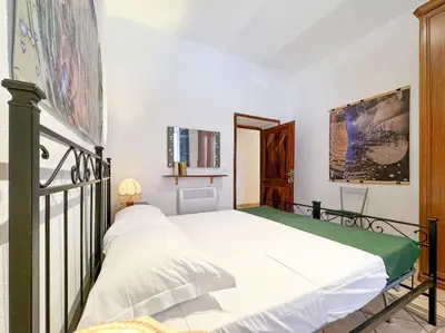 a bedroom with two beds in a room at Vatican Art Apartment in Rome