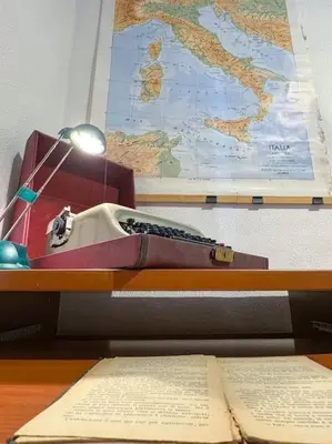 a desk with a sink and a map and a book at Vatican Art Apartment in Rome