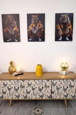 a room with four pictures of tigers on the wall at Suite Maison San Pietro , Vaticano, AC & Wi-Fi in Rome