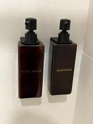 two bottles of shory wash sitting next to each other at Suite Maison San Pietro , Vaticano, AC & Wi-Fi in Rome