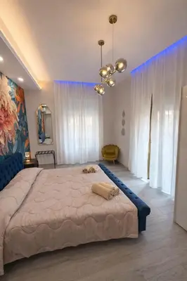 a bedroom with a large bed in a room at Suite Maison San Pietro , Vaticano, AC & Wi-Fi in Rome
