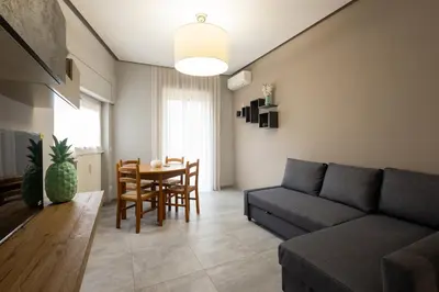 a living room with a couch and a table at Jmartins Vatican Apartment in Rome