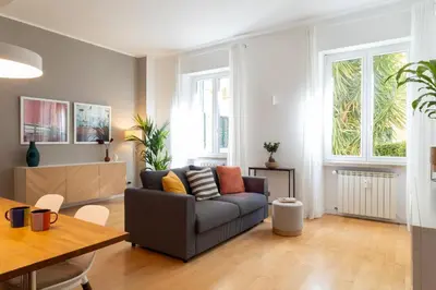 a living room with a couch and a table at Casa Porta Metronia in Rome