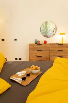a bedroom with two beds with a tray of food on it at Casa Porta Metronia in Rome