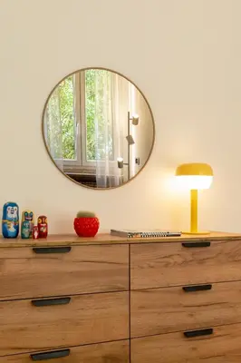a dresser with a mirror on top of it at Casa Porta Metronia in Rome