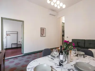 a living room with a table with wine glasses at The Best Rent - Two-bedroom apartment in Santa Maria Maggiore in Rome
