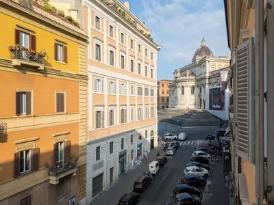 a view of a city street with buildings and cars at The Best Rent - Two-bedroom apartment in Santa Maria Maggiore in Rome