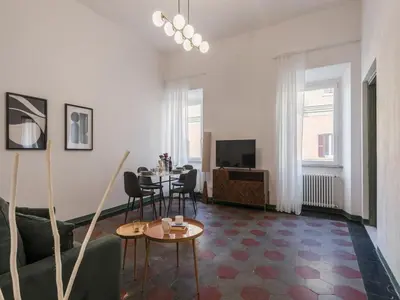 a living room with a couch and a table at The Best Rent - Two-bedroom apartment in Santa Maria Maggiore in Rome