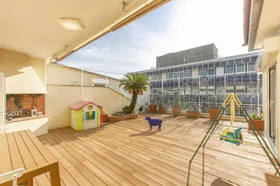 a large room with a playground and a building at Luxe Vatican Penthouse in Rome