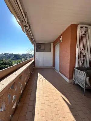 a balcony with a bench on a brick building at Premium Apartment Papillo in Rome