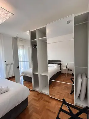 a large mirror in a bedroom with a bed at Premium Apartment Papillo in Rome