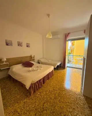 a bedroom with a bed in a room with a window at Domus Romae Caffarella in Rome