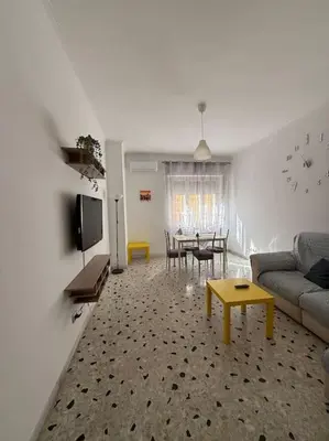 a living room with a couch and a table at Domus Romae Caffarella in Rome