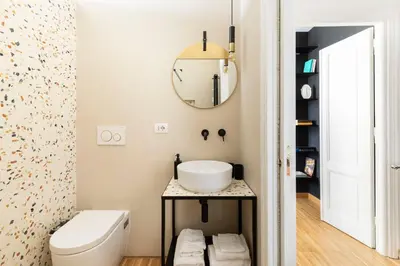 a bathroom with a sink and a mirror at YCH-Charming home near San Giovanni in Rome