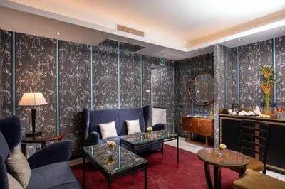 a living room with a couch and a table at The Inn at the Spanish Steps Luxury Collection - Mario de' Fiori Home in Rome