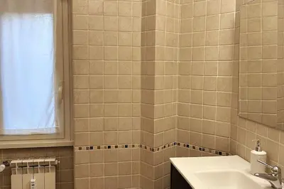 a bathroom with a sink and a mirror at A casa di Leo in Rome