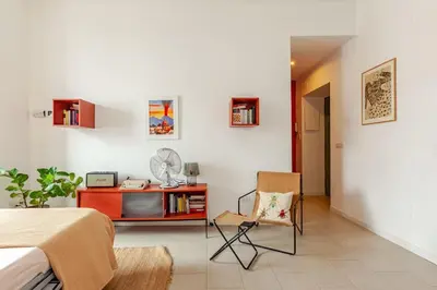 a bedroom with a bed and a desk and a chair at Appartamento moderno a due passi dal Colosseo in Rome
