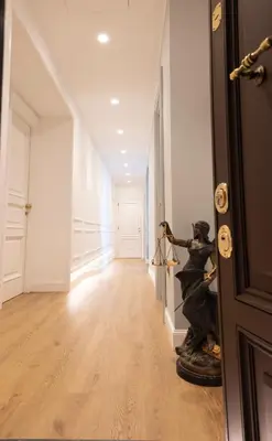 a hallway with a statue in the middle of a room at Tiburtina 86 Luxury Suites in Rome